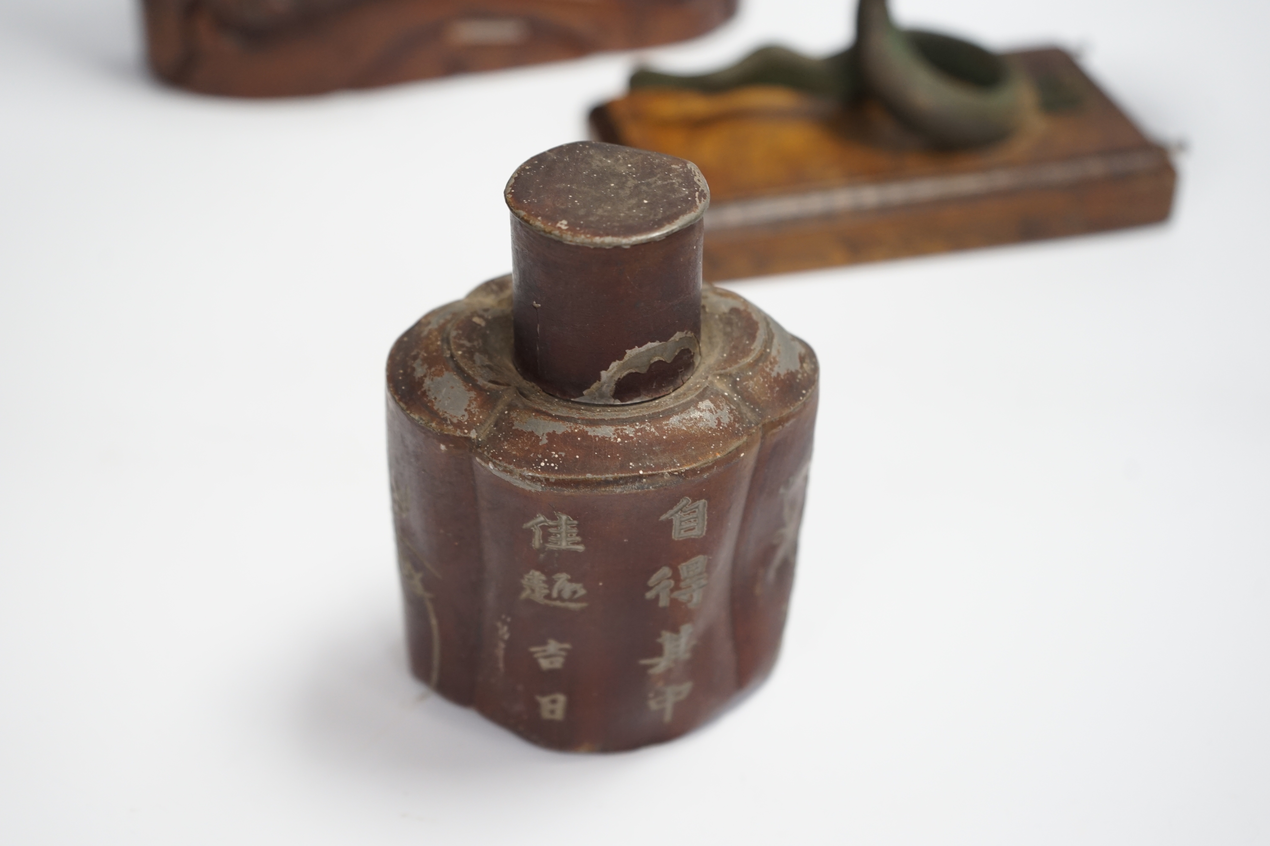 A Chinese table bell, pewter tea canister and an Indian ‘cobra’ hook, bell in frame 34.5cm high